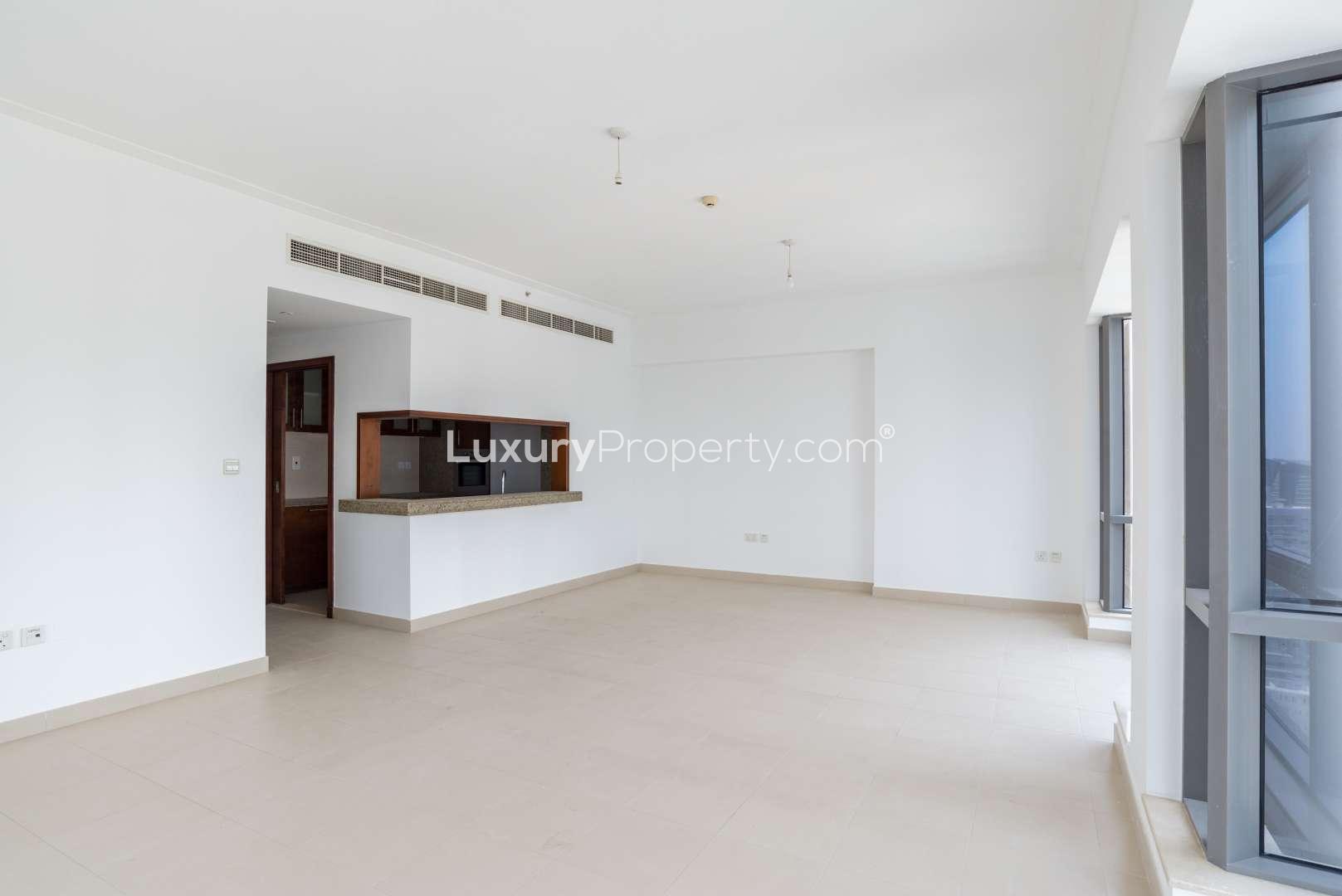 Empty living room in 2-bedroom apartment, South Ridge, Downtown Dubai, with large window view