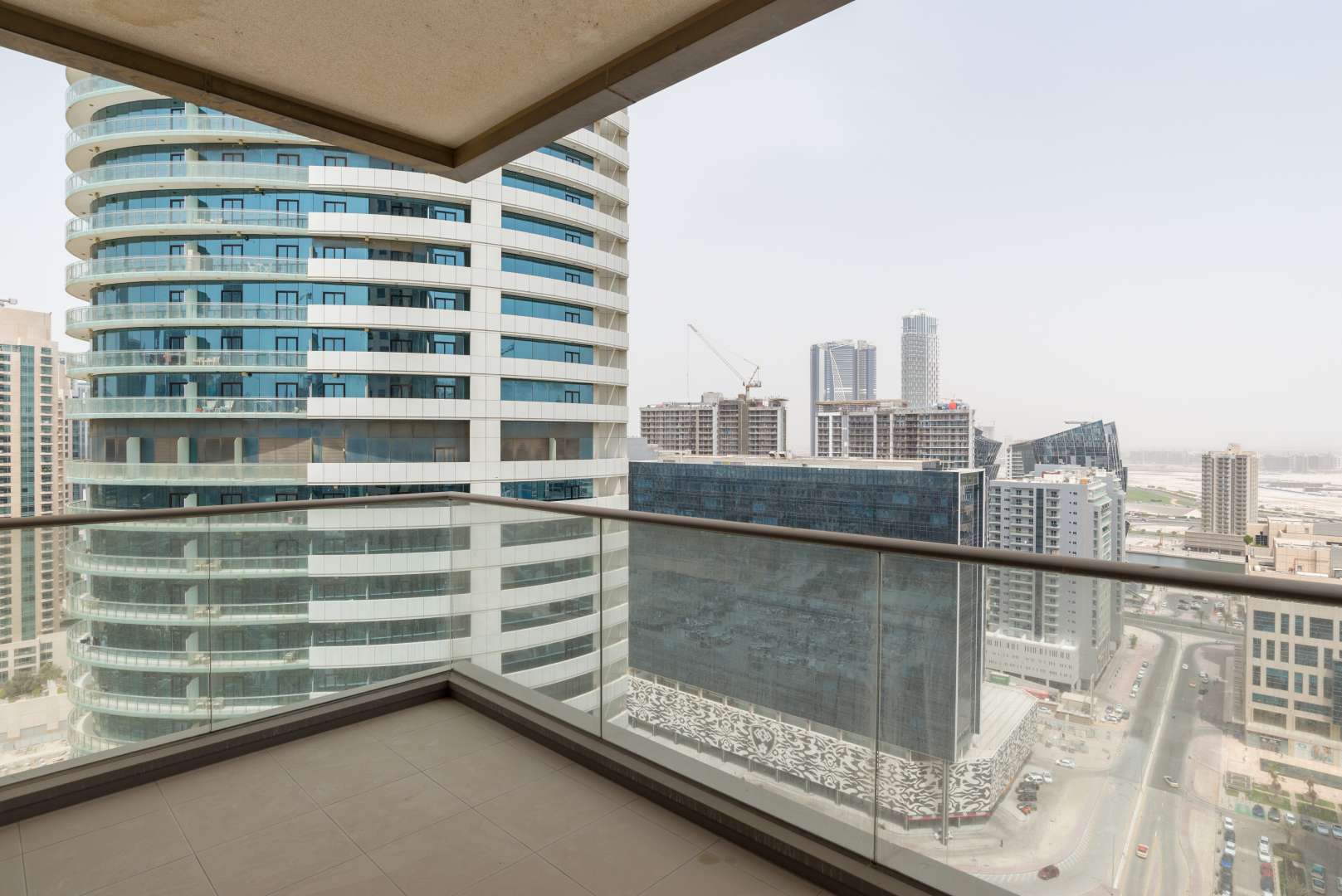 Spacious living room with large windows in South Ridge apartment, Downtown Dubai for rent