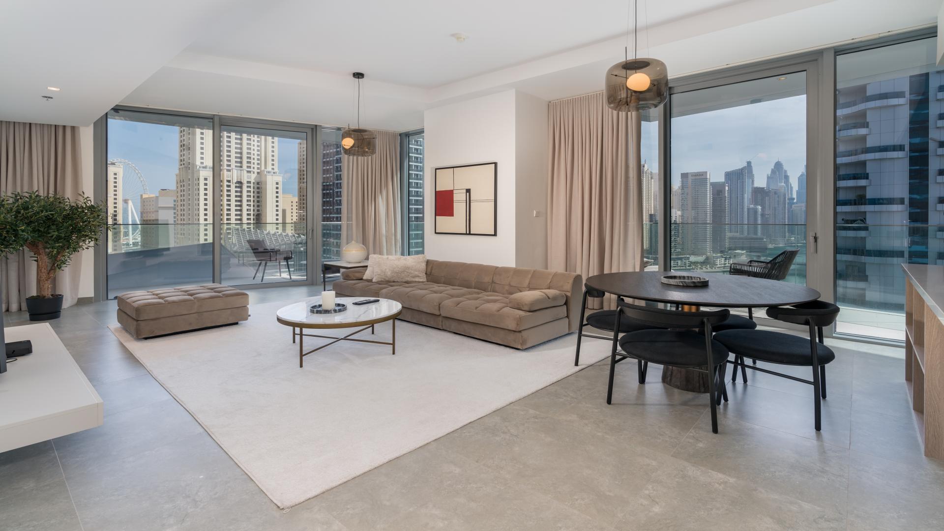 Luxury apartment balcony view of Dubai Marina skyline and waterfront in Stella Maris
