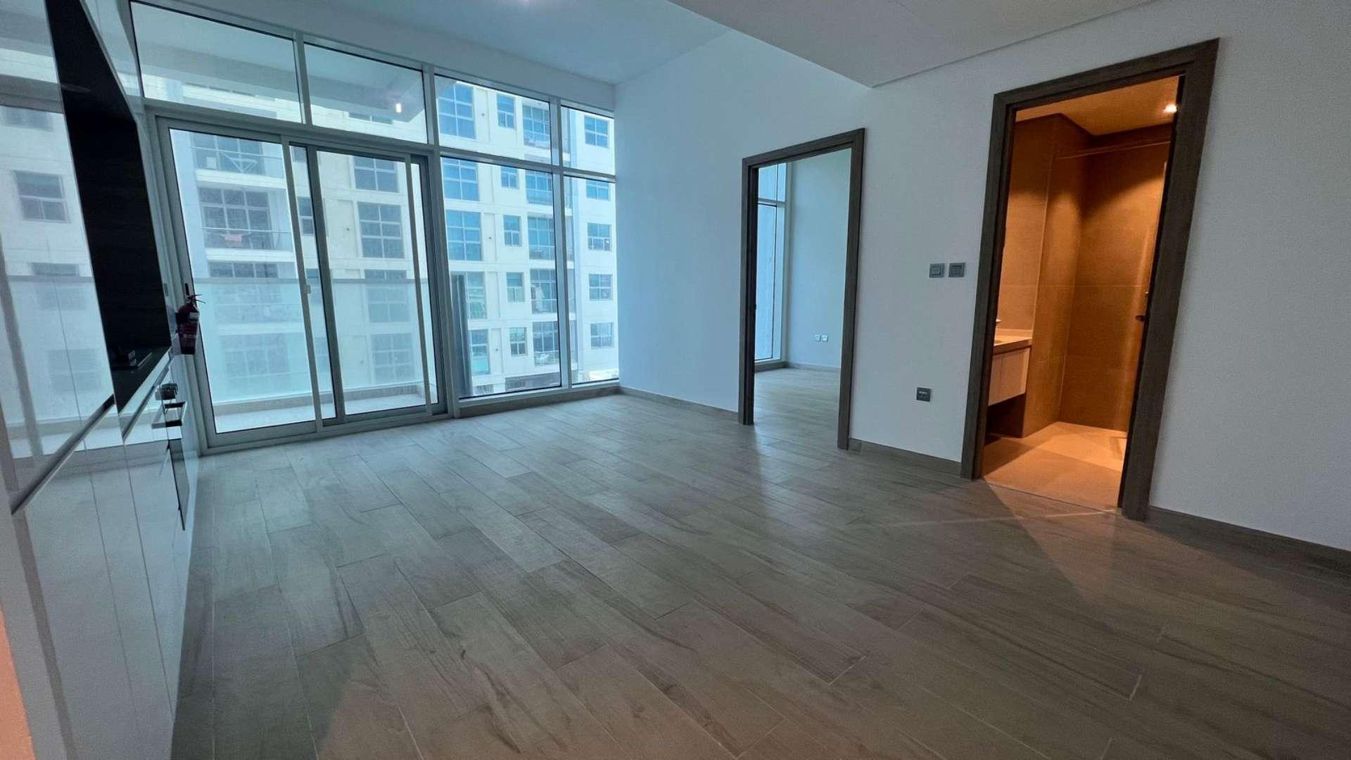 Rooftop pool view at Studio One apartment, Dubai Marina, surrounded by city skyline