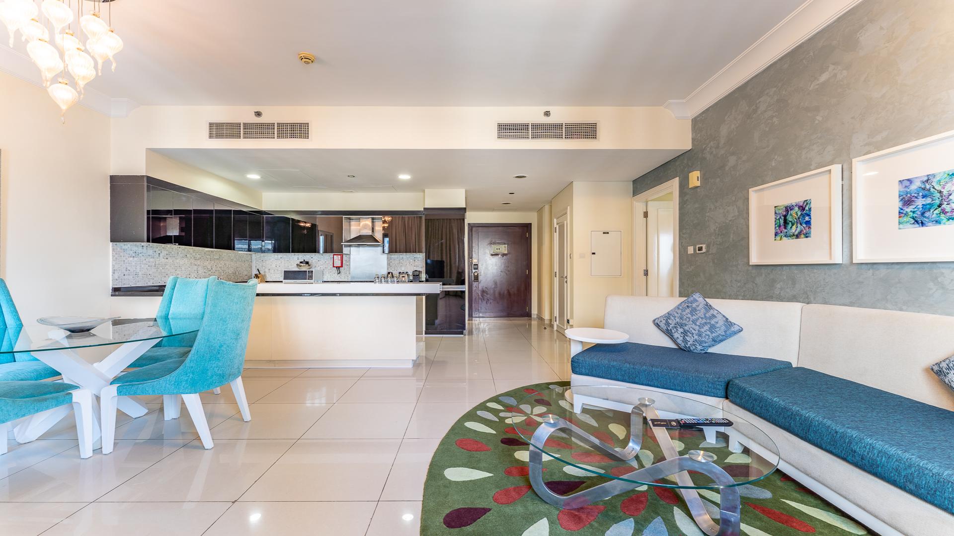 Modern kitchen and dining area in The Signature apartment, Downtown Dubai