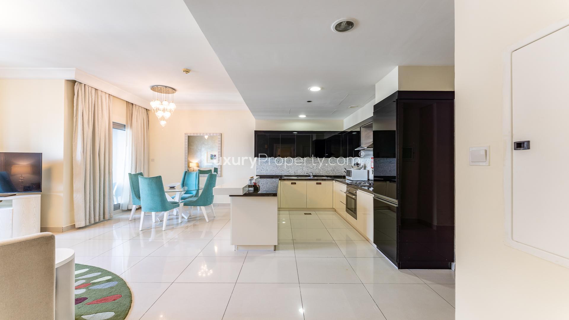 Modern living room and kitchen in 2-bedroom apartment, The Signature, Downtown Dubai