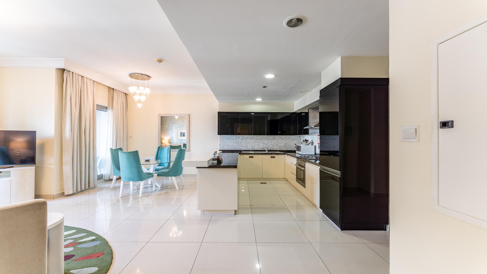 Modern living room and kitchen in 2-bedroom apartment, The Signature, Downtown Dubai