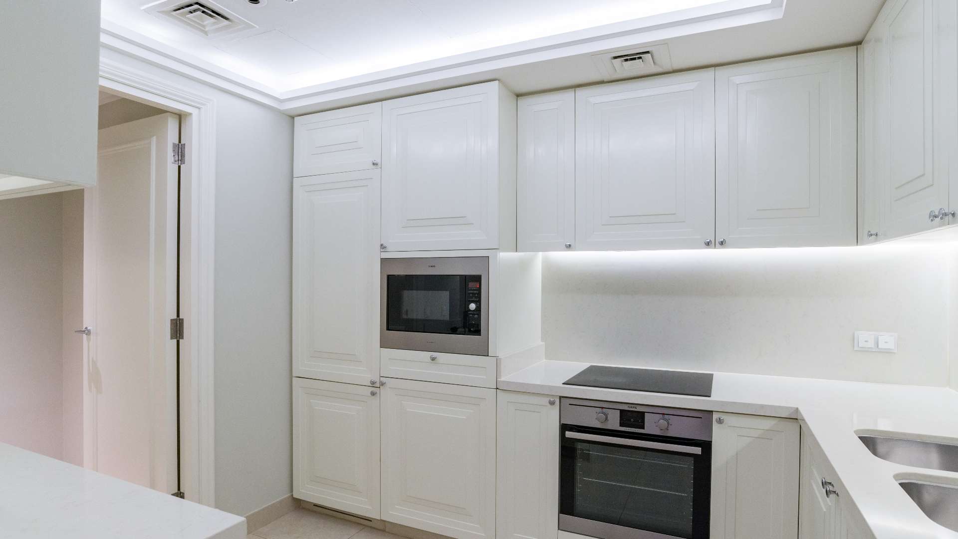 "Stunning Downtown Dubai skyline view from The Address Boulevard apartment balcony, featuring Burj Khalifa.",High-end apartment balcony view of Downtown Dubai skyline, The Address BLVD Sky Collection