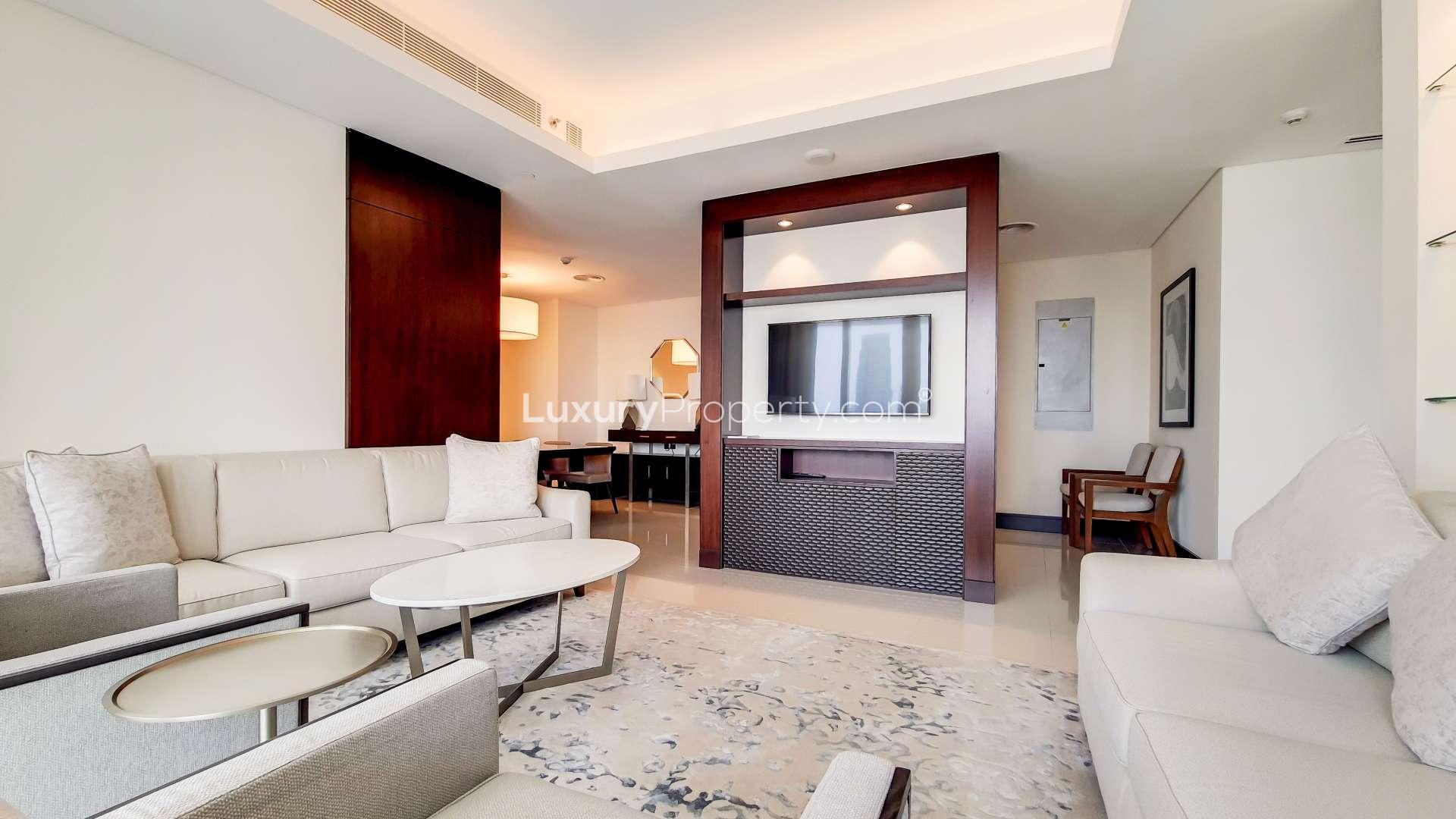 Balcony view from The Address Downtown apartment overlooking Dubai skyline and Burj Lake