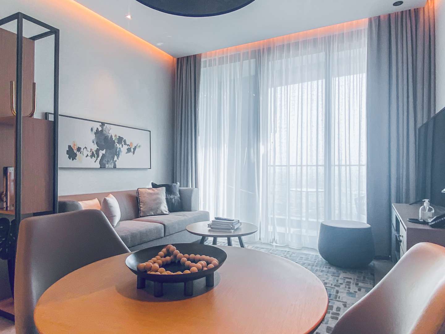 Modern living room in serviced two-bedroom apartment, Jumeirah Beach Residence, with elegant decor