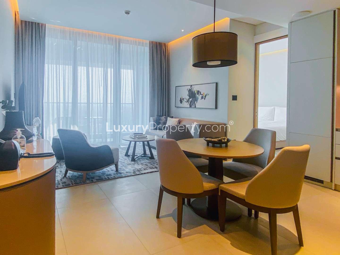 Living room with balcony view in serviced Jumeirah Beach Residence apartment