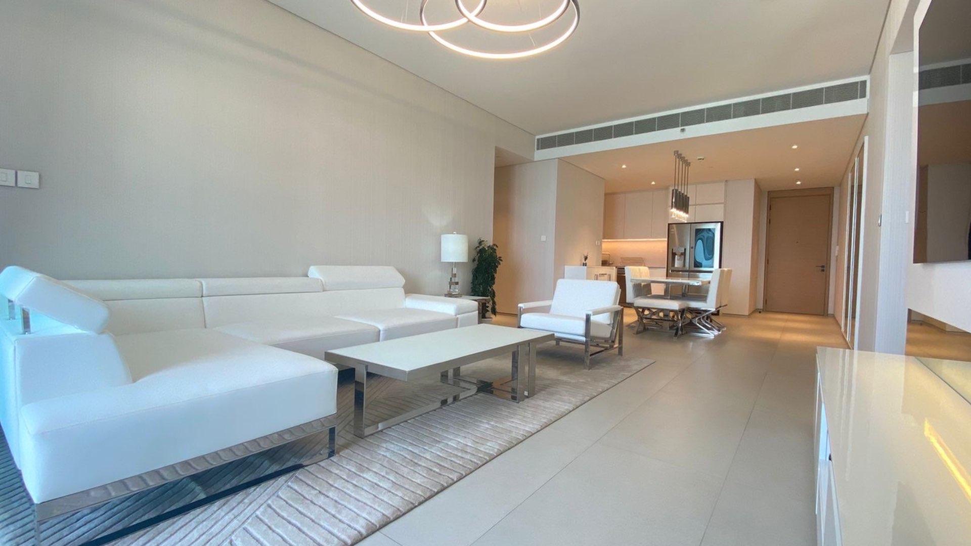 Balcony view from furnished two-bedroom apartment in Address JBR, overlooking ocean and Ferris wheel