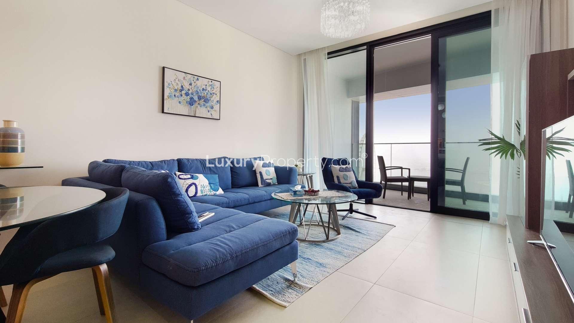 Luxurious Jumeirah Beach Residence apartment living room with modern decor and blue sofa
