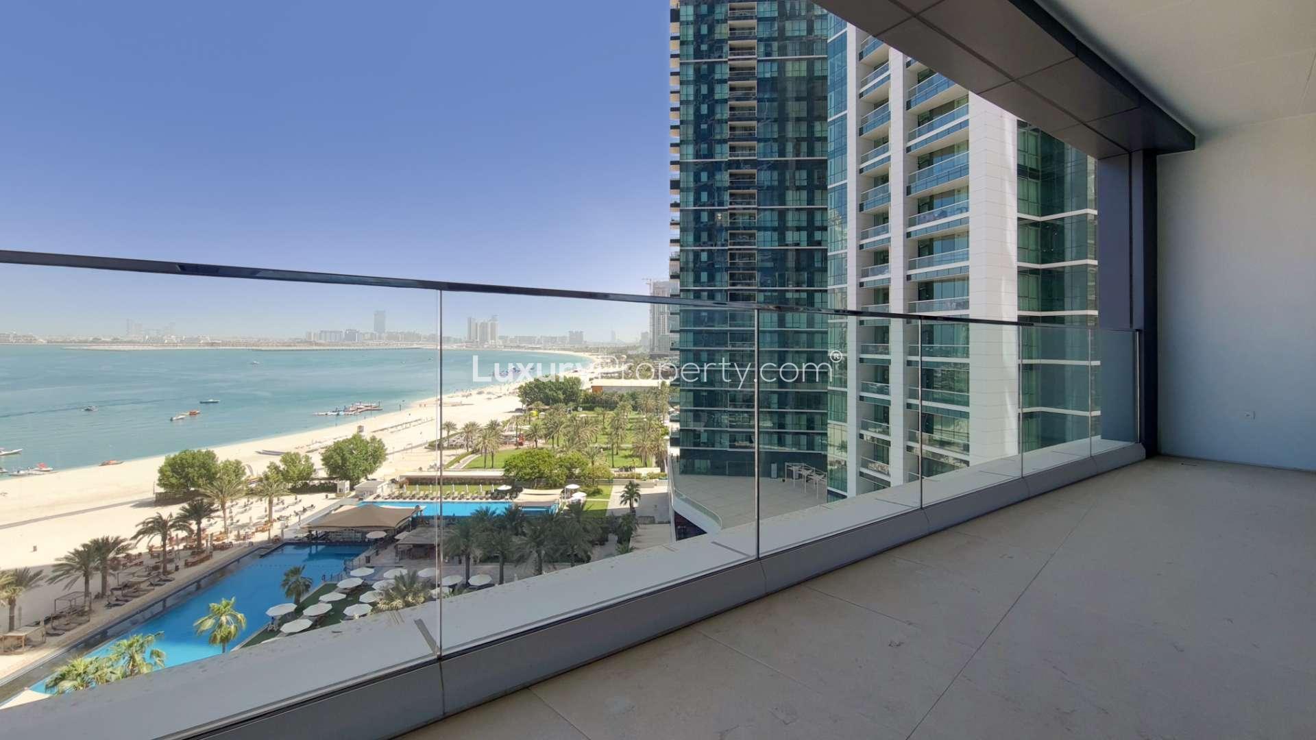 Modern kitchen in Jumeirah Beach Residence apartment with sleek cabinetry and built-in appliances