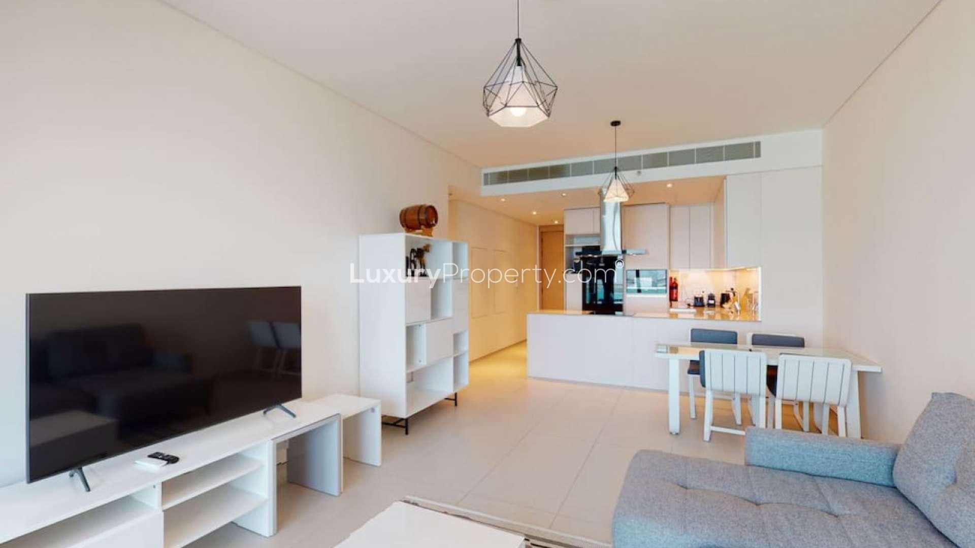 Furnished living room with sea view balcony at The Address Jumeirah Resort apartment