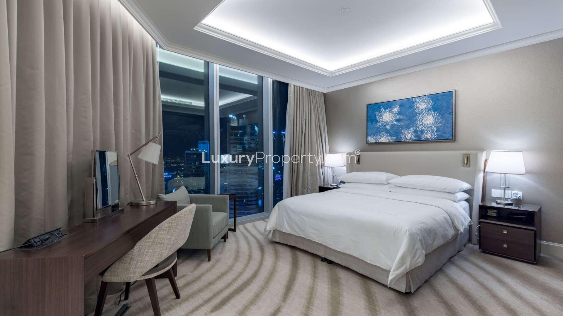 Modern living and dining area in Downtown Dubai apartment with elegant furnishings and decor
