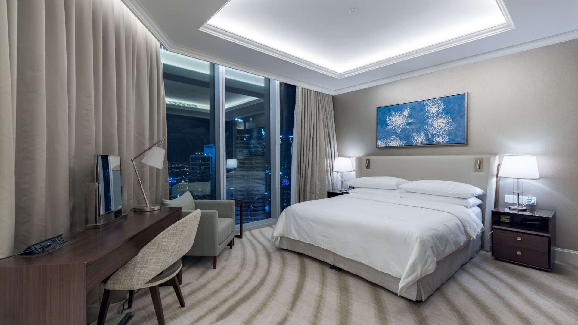 Modern living and dining area in Downtown Dubai apartment with elegant furnishings and decor