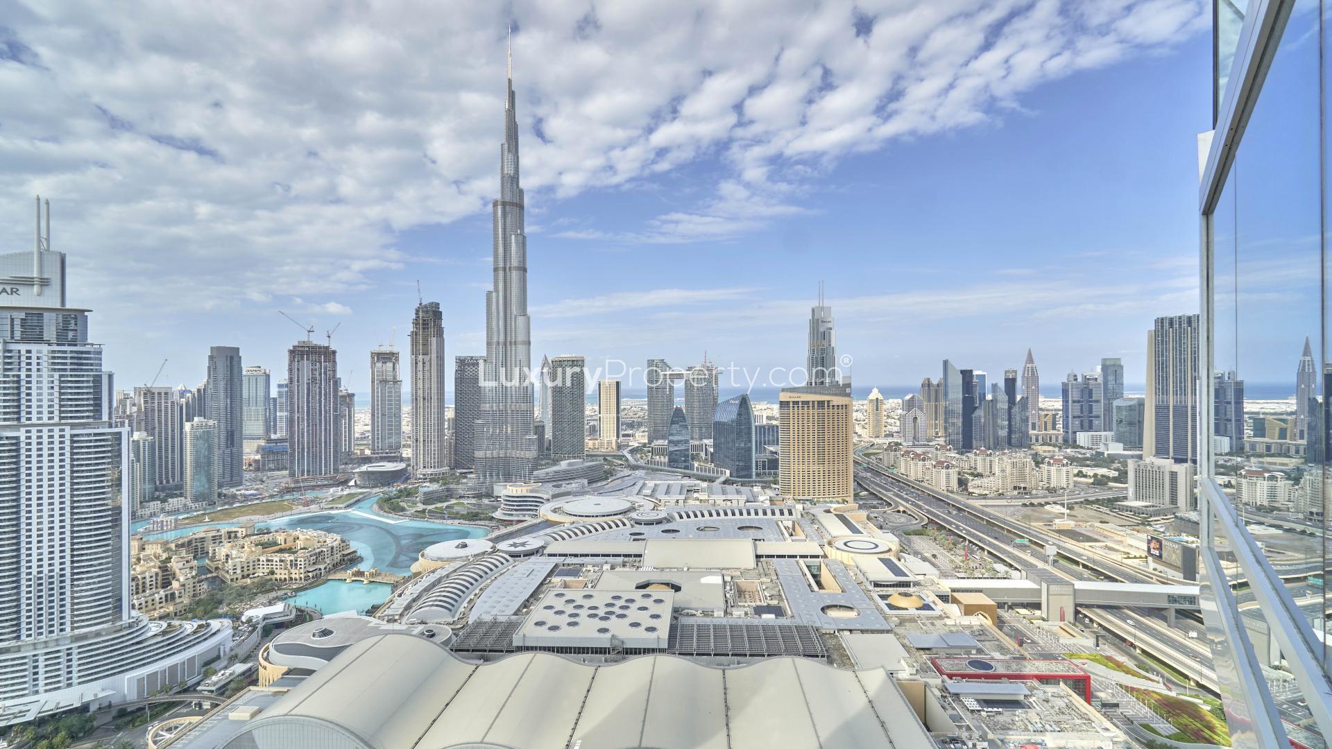 "Fully furnished Downtown Dubai apartment with panoramic Burj Khalifa views, elegant living area.",Panoramic Burj Khalifa view from spacious, fully furnished apartment in Downtown Dubai for rent