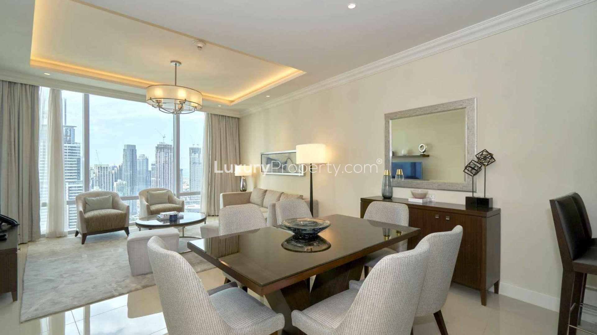 "Apartment balcony with stunning Burj Khalifa view, Downtown Dubai, The Address Residence Fountain Views.",Modern Downtown Dubai apartment living room with Burj Khalifa view through large windows