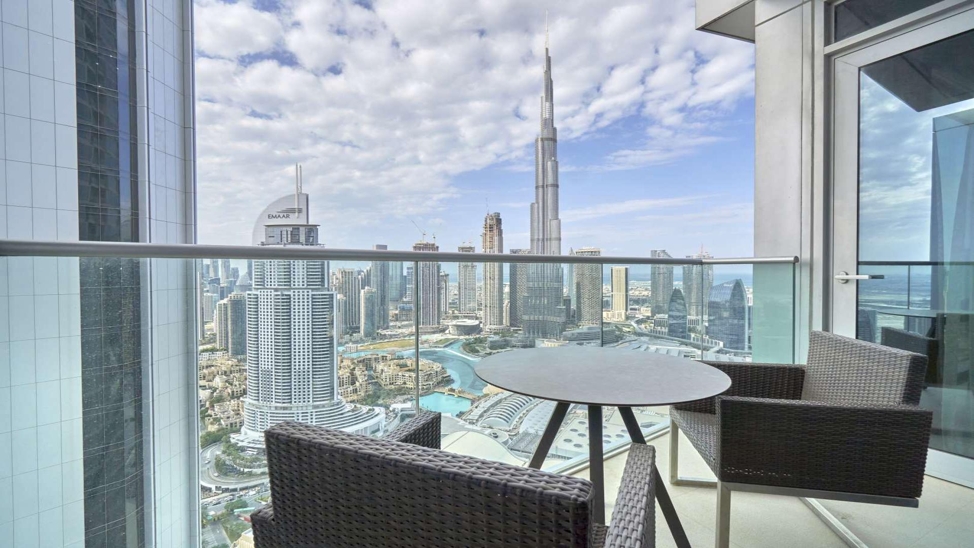 Luxurious Downtown Dubai apartment with Burj Khalifa view, stylish living room, natural light
