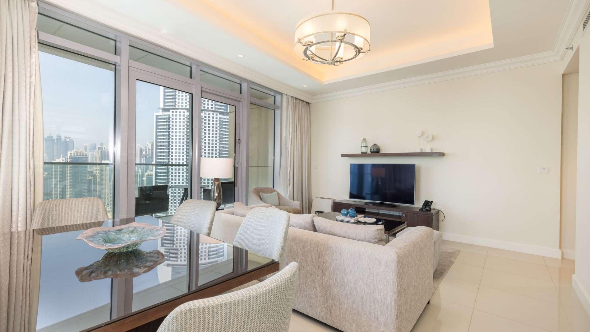 Furnished living room with modern decor in Downtown Dubai apartment, Burj Khalifa view