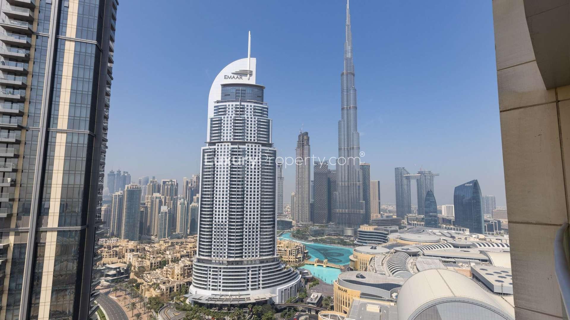 "Balcony view of Burj Khalifa from furnished 2-bedroom apartment in Downtown Dubai, for rent.","Stunning Burj Khalifa view from Downtown Dubai apartment in The Address Residence Fountain Views.",Modern kitchen in furnished Downtown Dubai apartment, The Address Residence Fountain Views, for rent