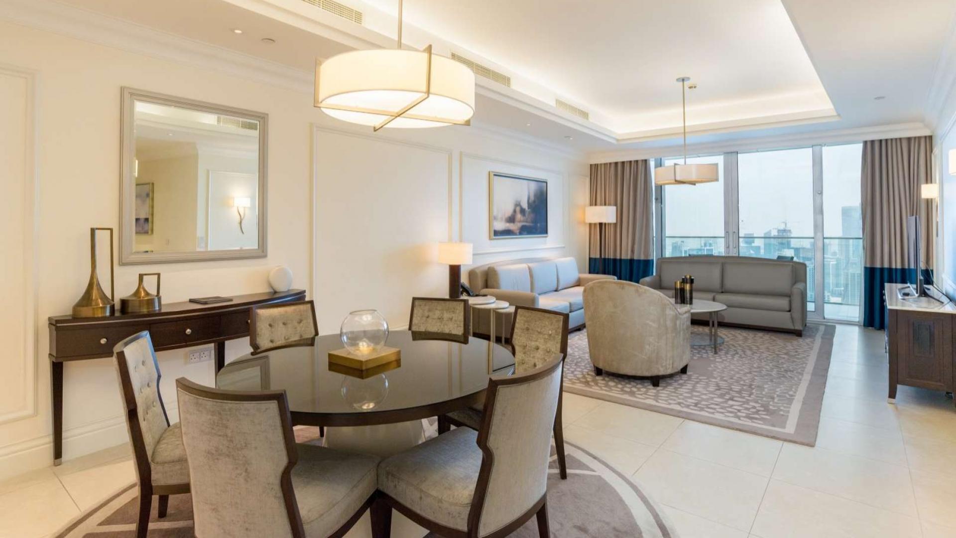 Furnished living and dining area in 2-bedroom apartment, The Address The Boulevard, Downtown Dubai