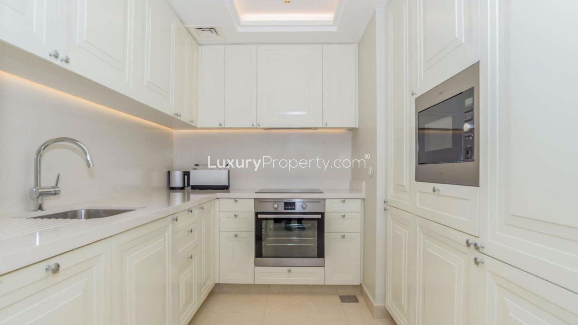 High-floor apartment living room with modern decor and downtown Dubai view at The Address BLVD