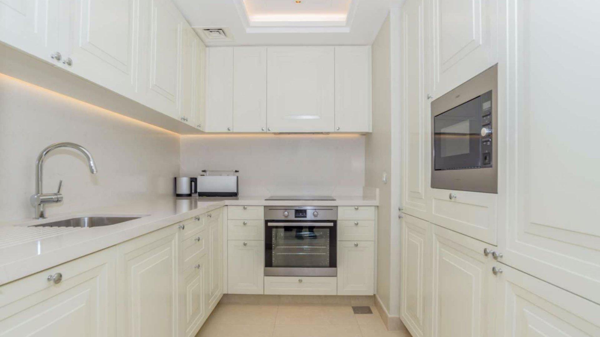 High-floor apartment living room with modern decor and downtown Dubai view at The Address BLVD