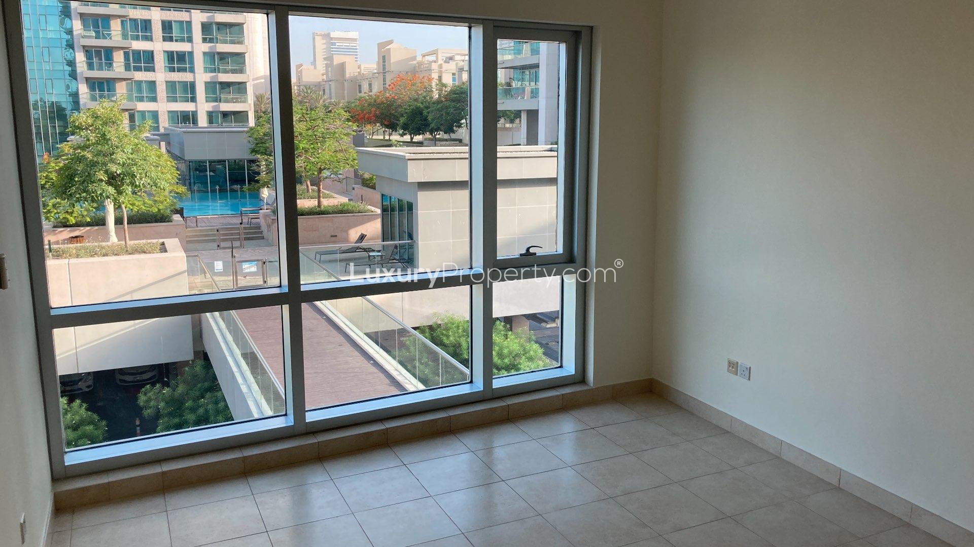 Aerial view of The Fairways apartment complex with pool and golf course in The Views
