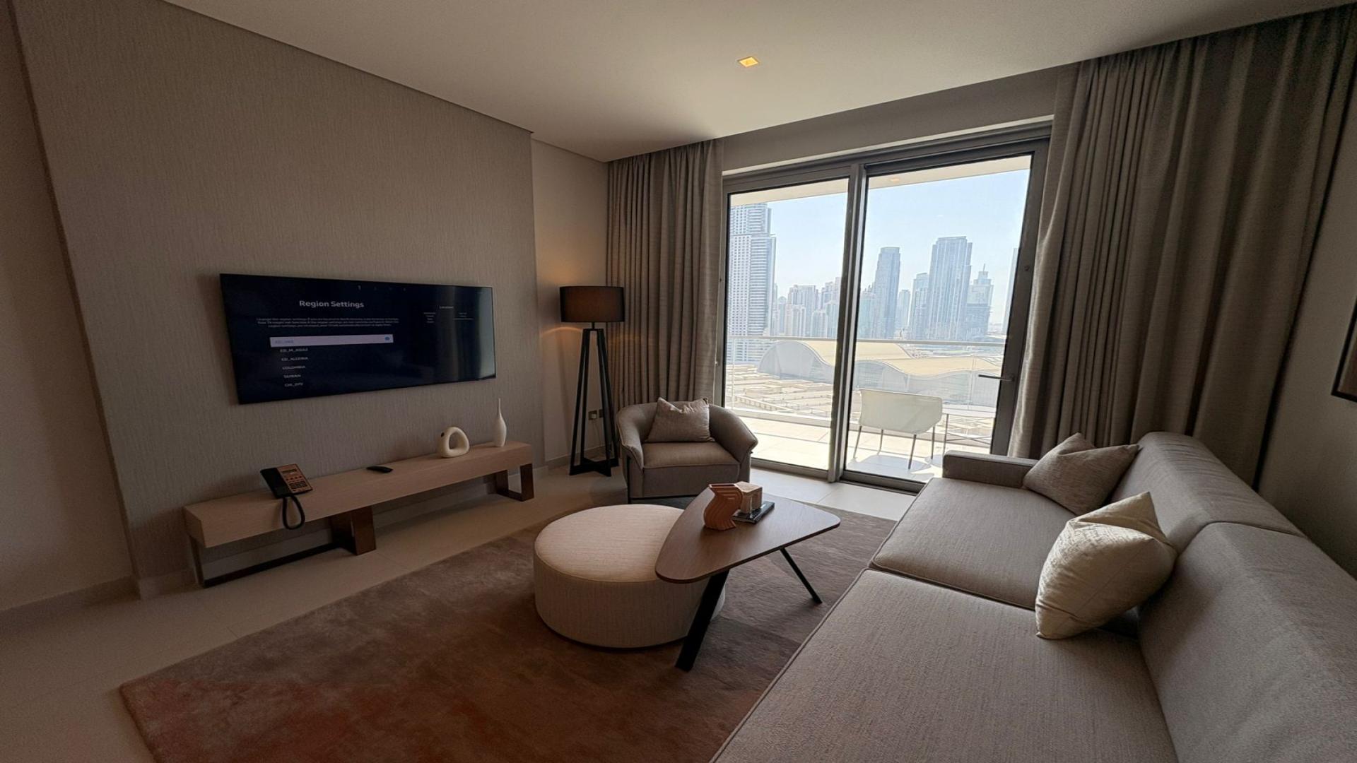 Fully furnished living room in Vida Dubai Mall apartment with city view, Downtown Dubai
