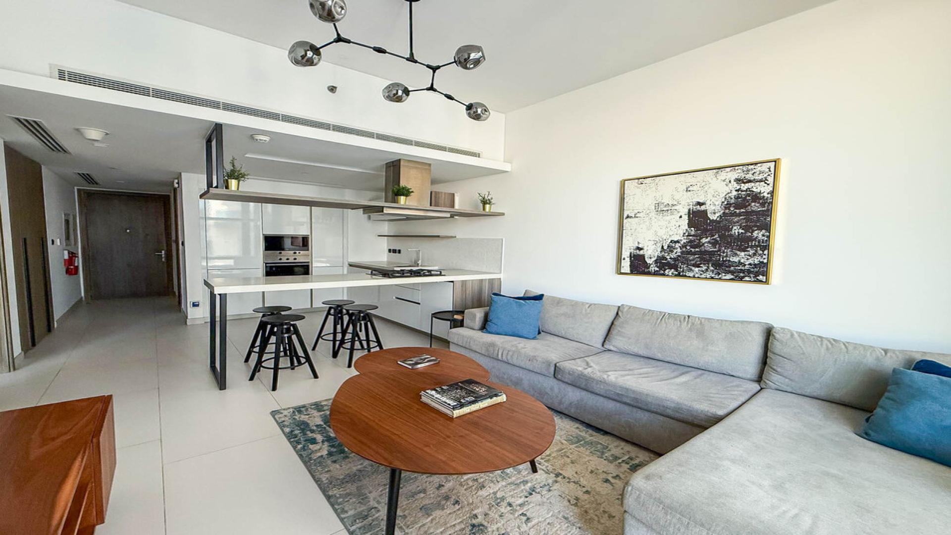 Modern living room with open kitchen in Soho Palm Jumeirah apartment, LP48983
