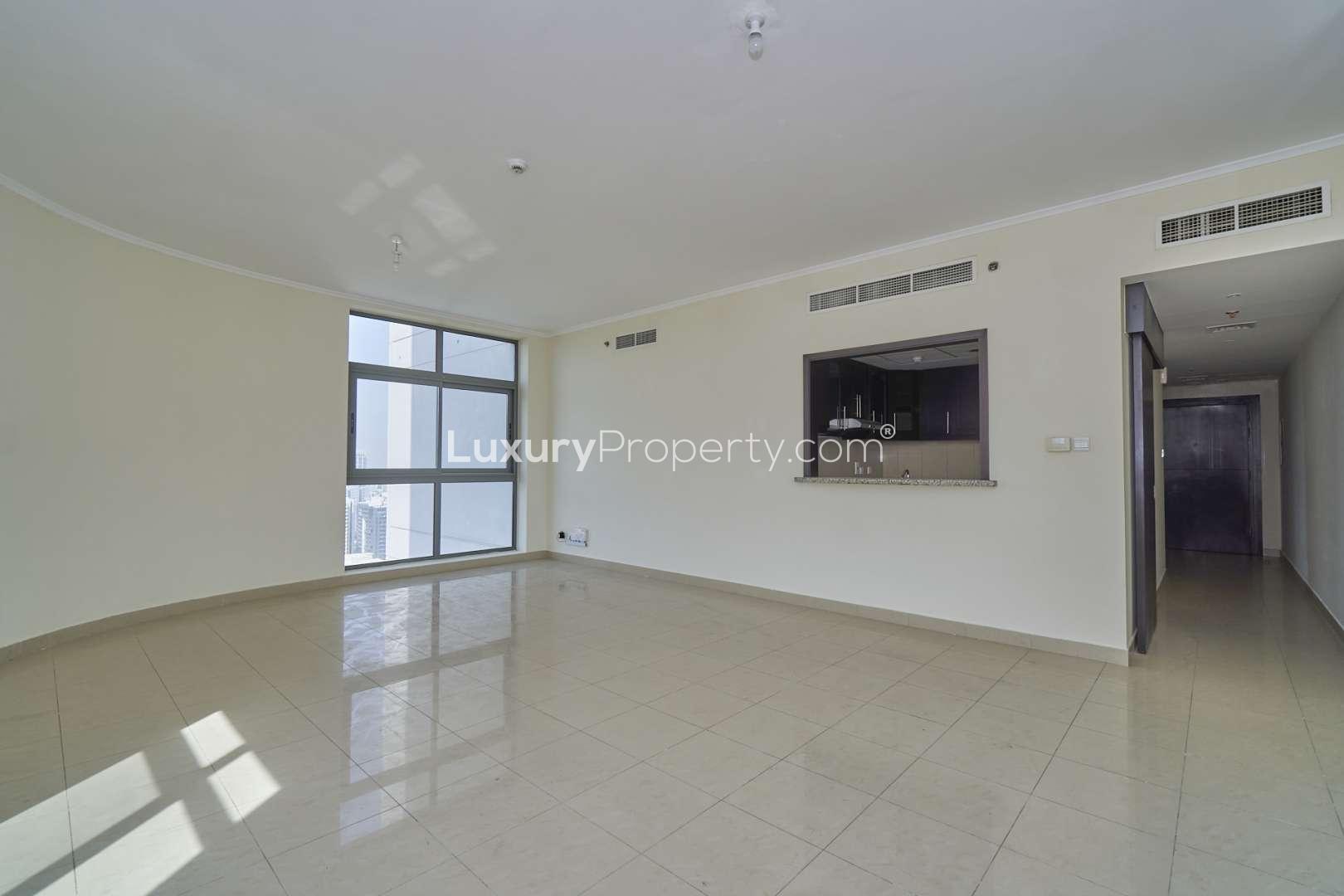 Bright living room with large windows in luxury apartment, Links West Tower, The Greens
