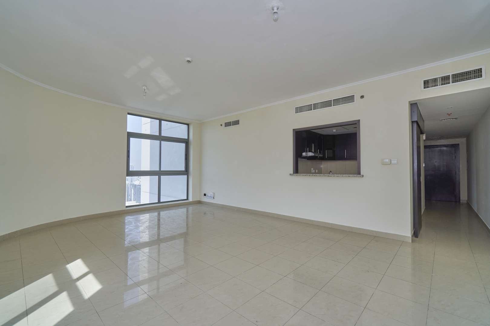 Bright living room with large windows in luxury apartment, Links West Tower, The Greens