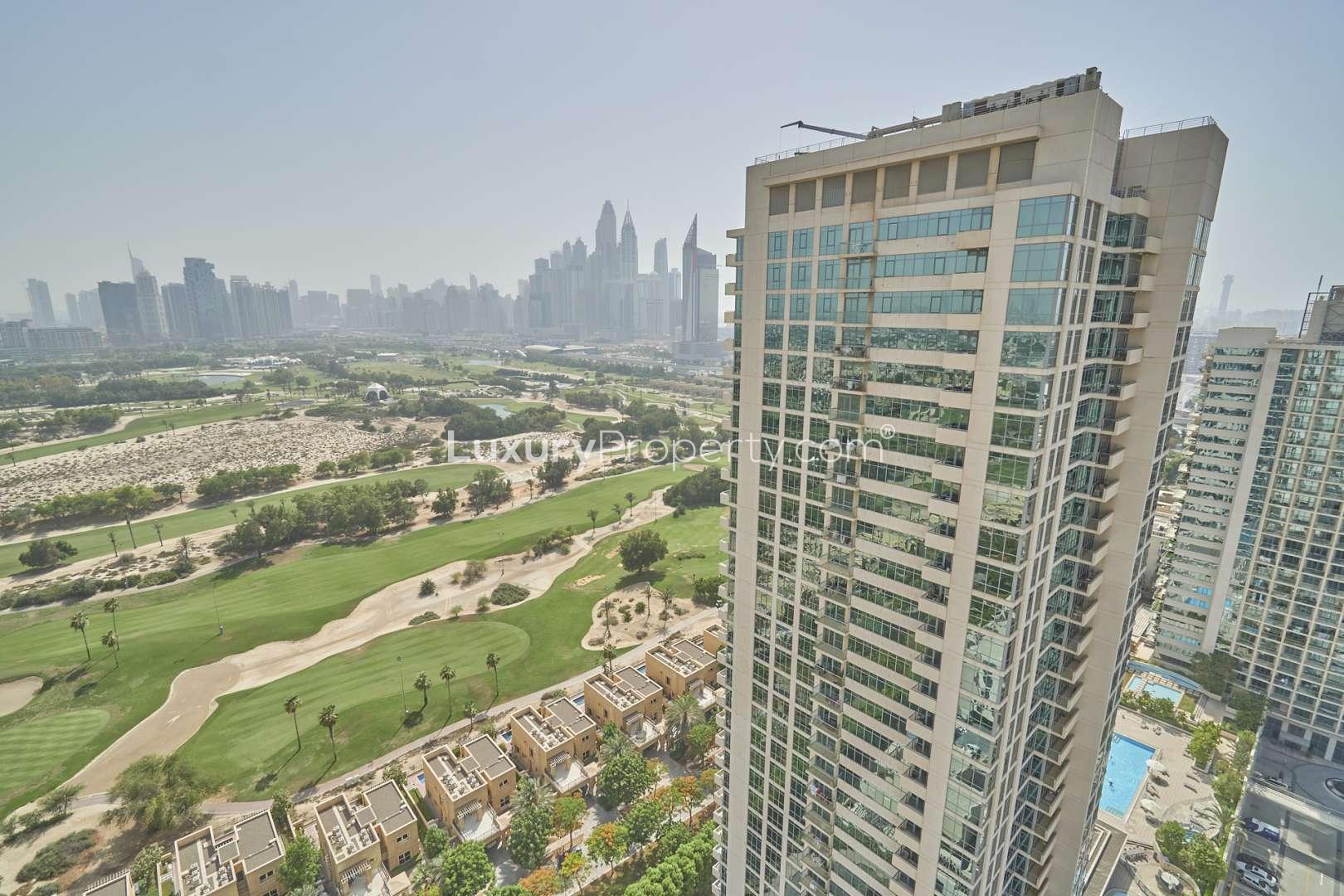Bright living room with large windows in The Links West Tower apartment, The Views