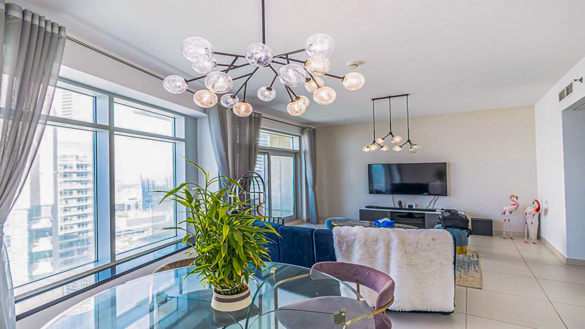 Elegant living room in 2-bedroom Downtown Dubai apartment with city views and modern decor