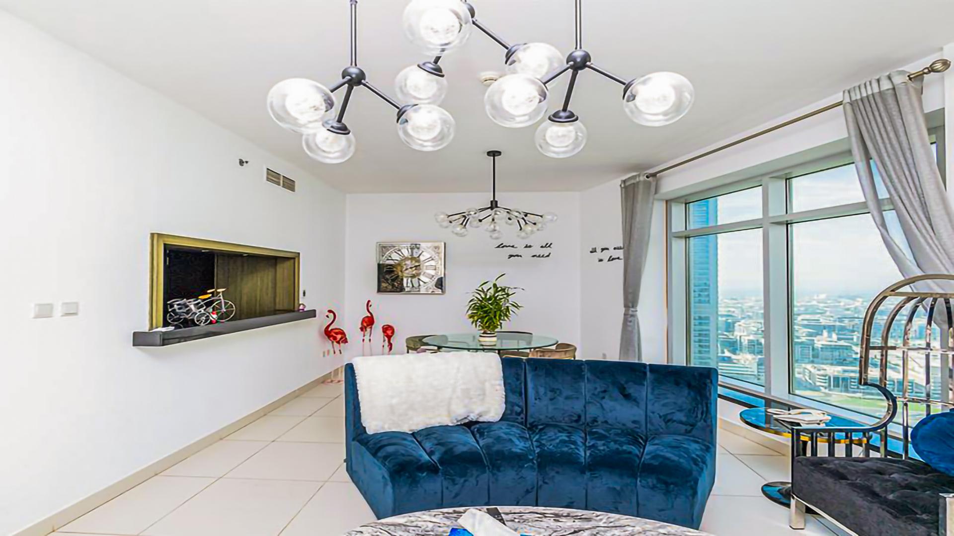 Elegant living room in 2-bedroom apartment, The Lofts, Downtown Dubai, featuring modern decor