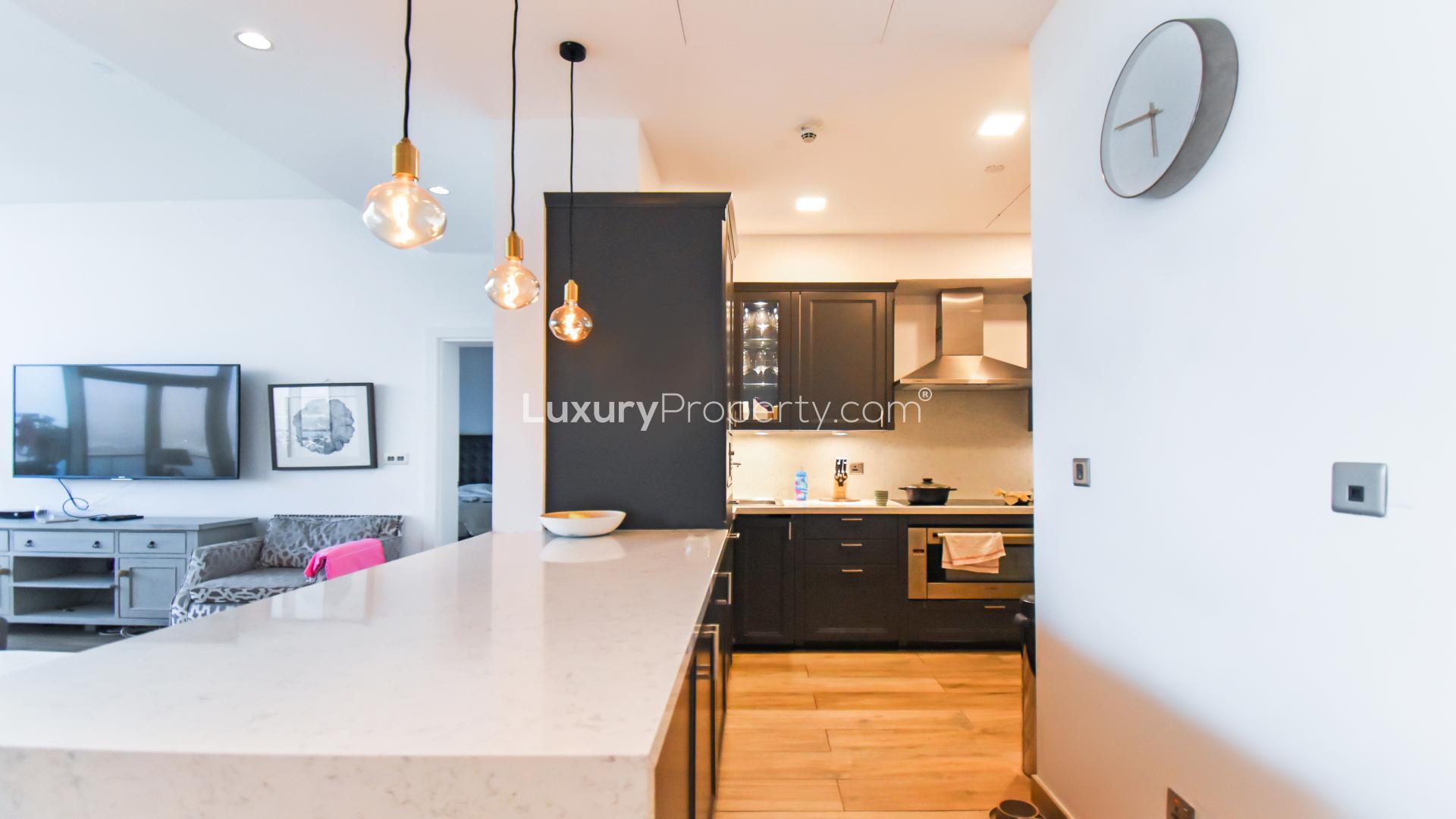 Dining area with sea and marina views in Tiara Residences, Palm Jumeirah apartment