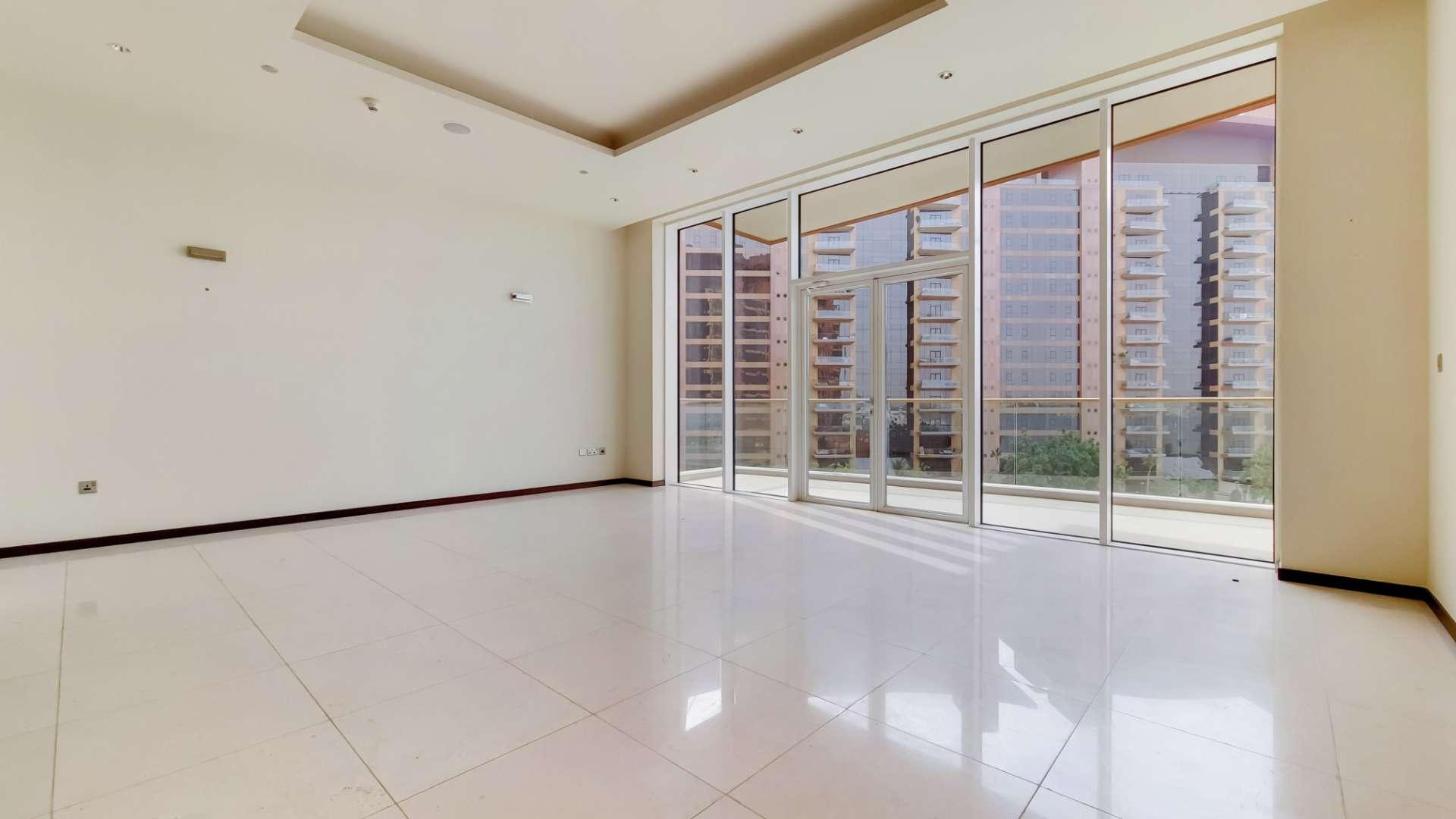 Balcony view of Tiara Residences apartment overlooking sea and pool, Palm Jumeirah