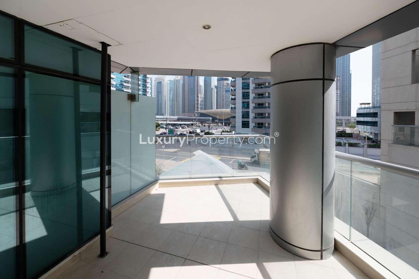 Spacious living room with large windows in Trident Bayside apartment, Dubai Marina for rent