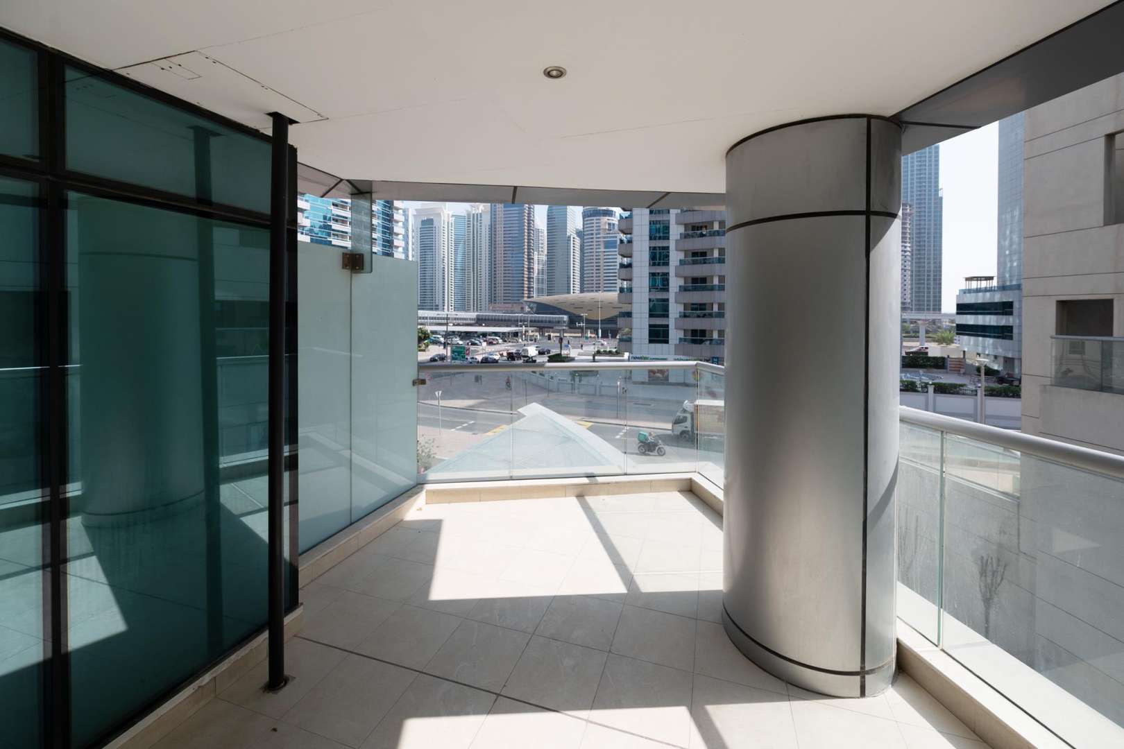Spacious living room with large windows in Trident Bayside apartment, Dubai Marina for rent