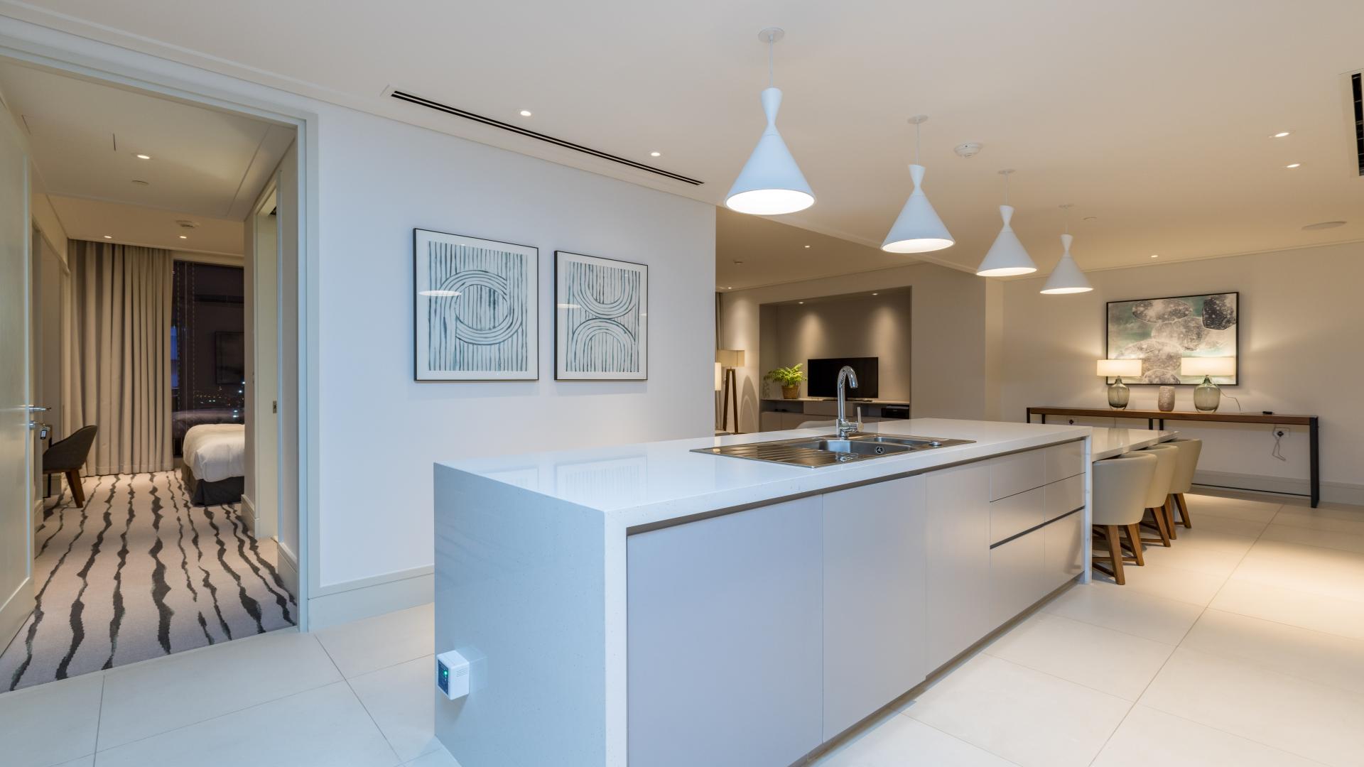 Modern kitchen and dining area in fully furnished 2-bedroom apartment, Vida Residence, Downtown Dubai