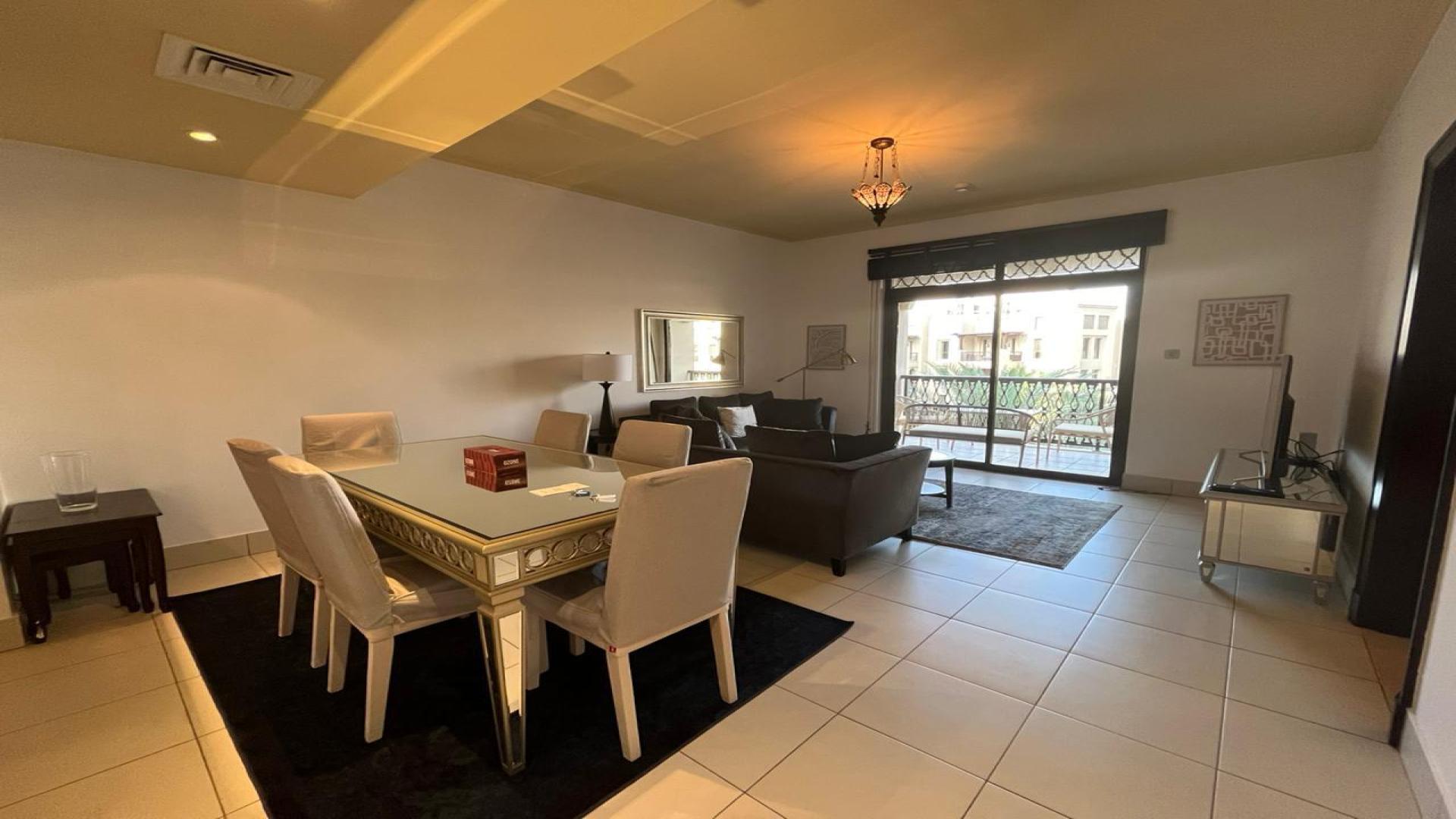 Furnished kitchen in Reehan apartment, Old Town, with modern cabinetry and tiled backsplash