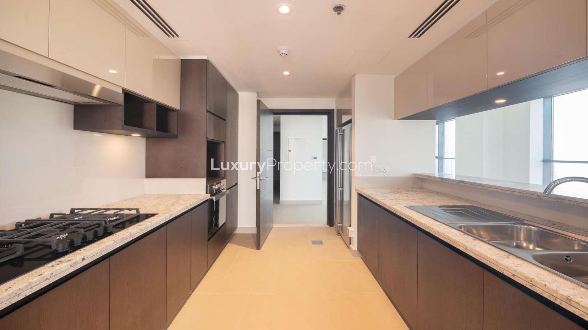 Mid-floor apartment interior with large windows, Burj Khalifa views, Dubai Creek Harbour