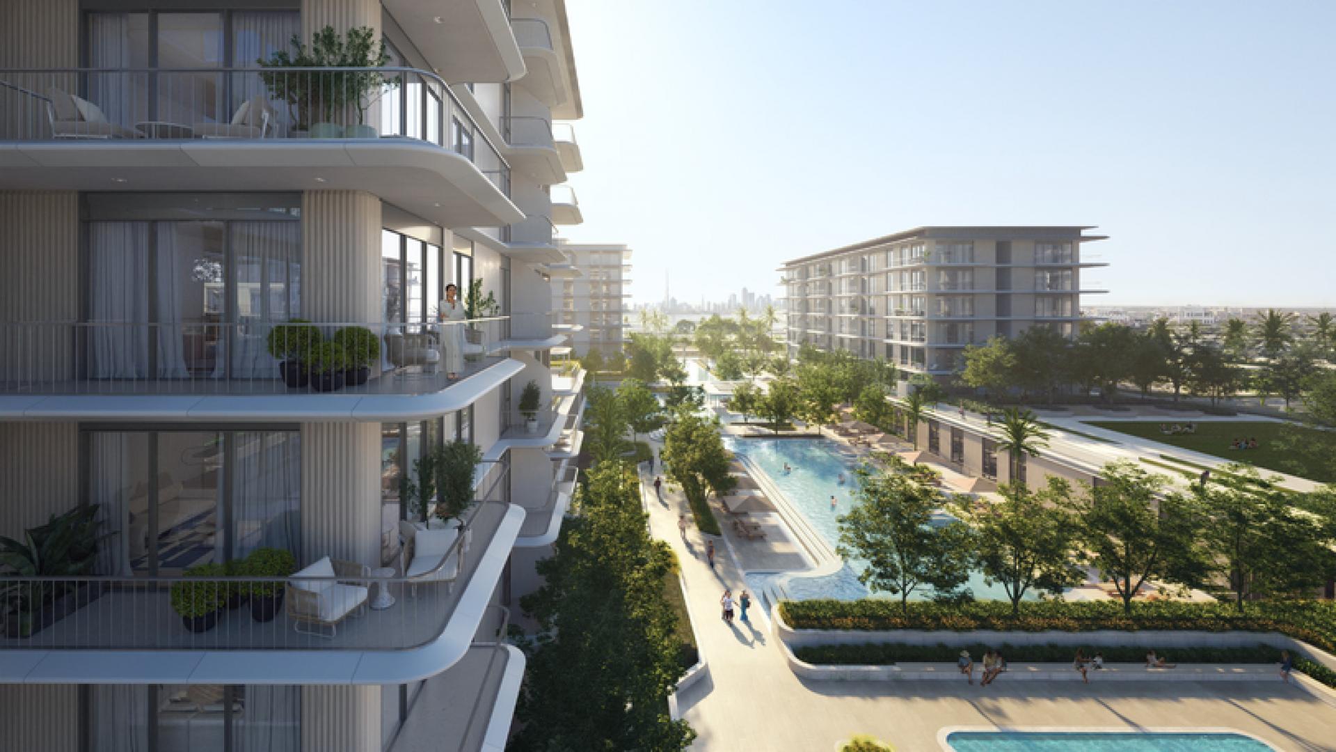 Luxurious pool area at Bayline apartment complex, Mina Rashid, with lounging facilities