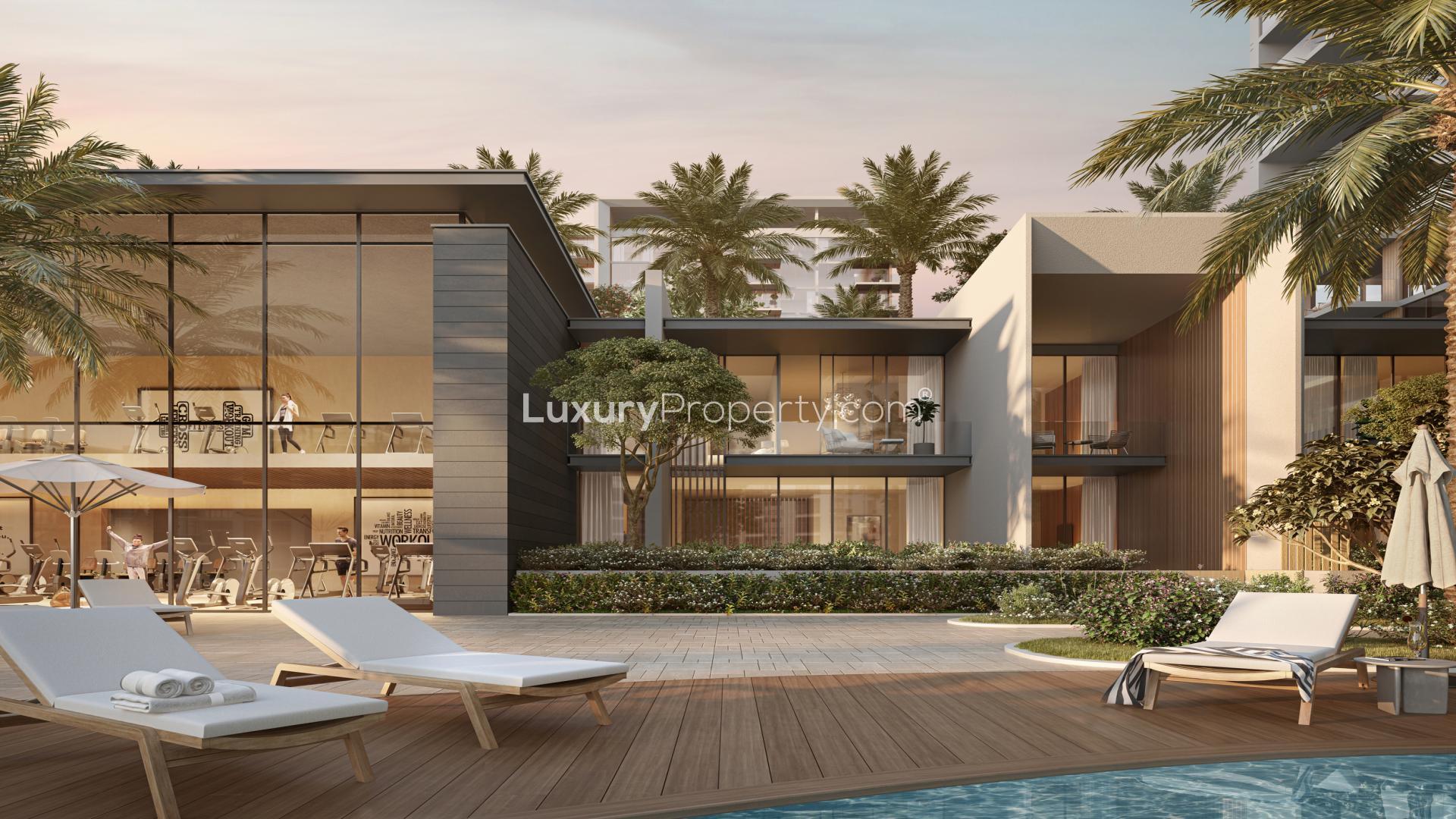 Elegant waterfront apartment building exterior in District One, Mohammed Bin Rashid City, at dusk