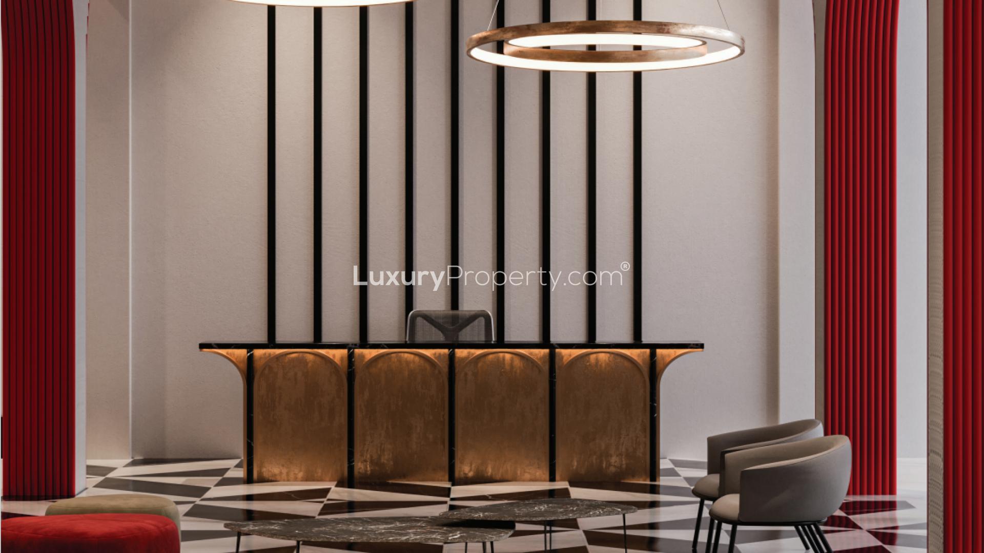 "Modern elevator lobby in Lilium Tower, Jumeirah Village Triangle apartment for sale.",Luxurious lobby interior in Lilium Tower, Jumeirah Village Triangle apartment for sale