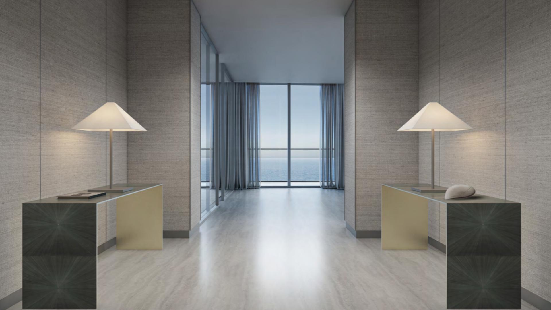 Luxurious Armani Beach Residences apartment with stunning floor-to-ceiling windows and pool view