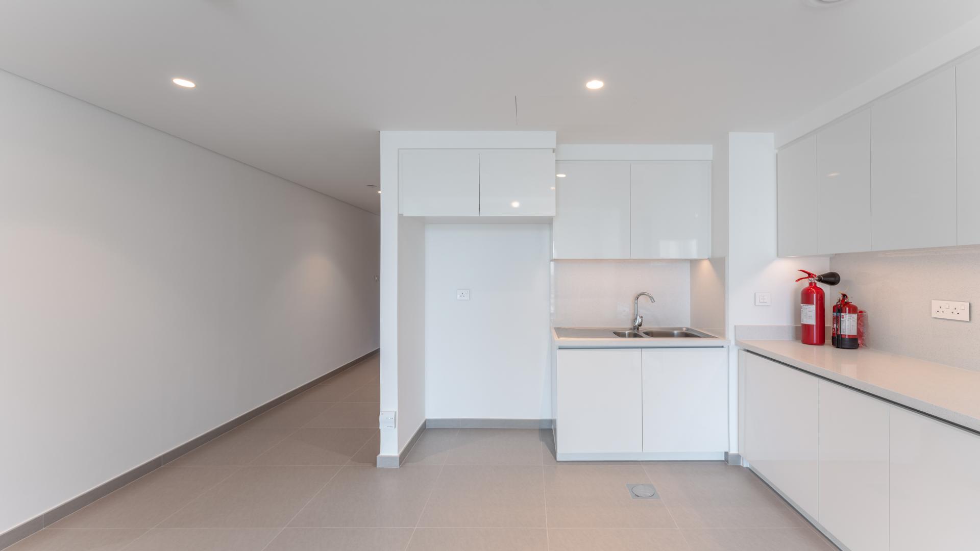 Modern open-plan living area in Downtown Dubai apartment for sale, spacious and bright