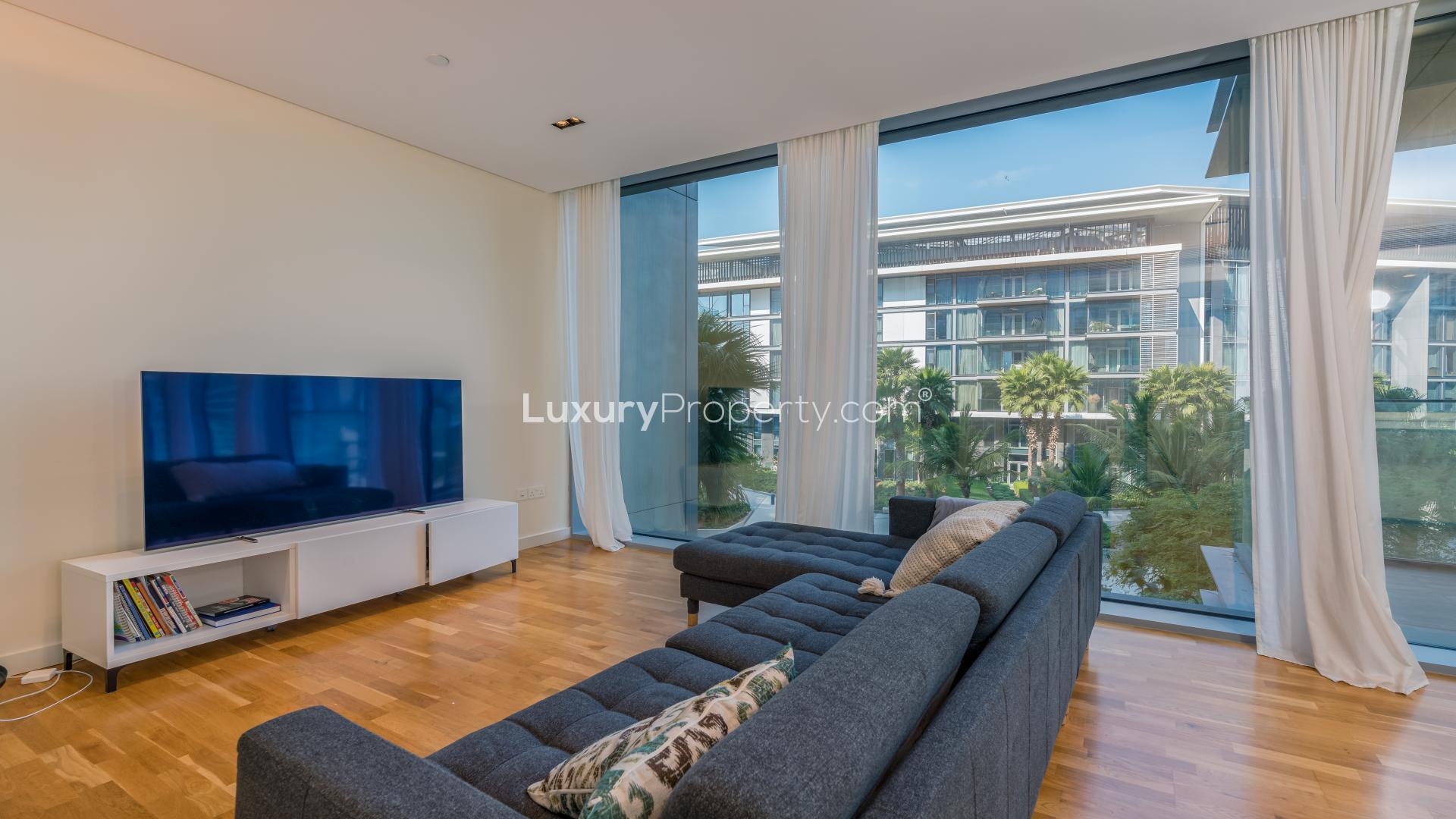Furnished apartment living room with garden view in Bluewaters Residences, for sale