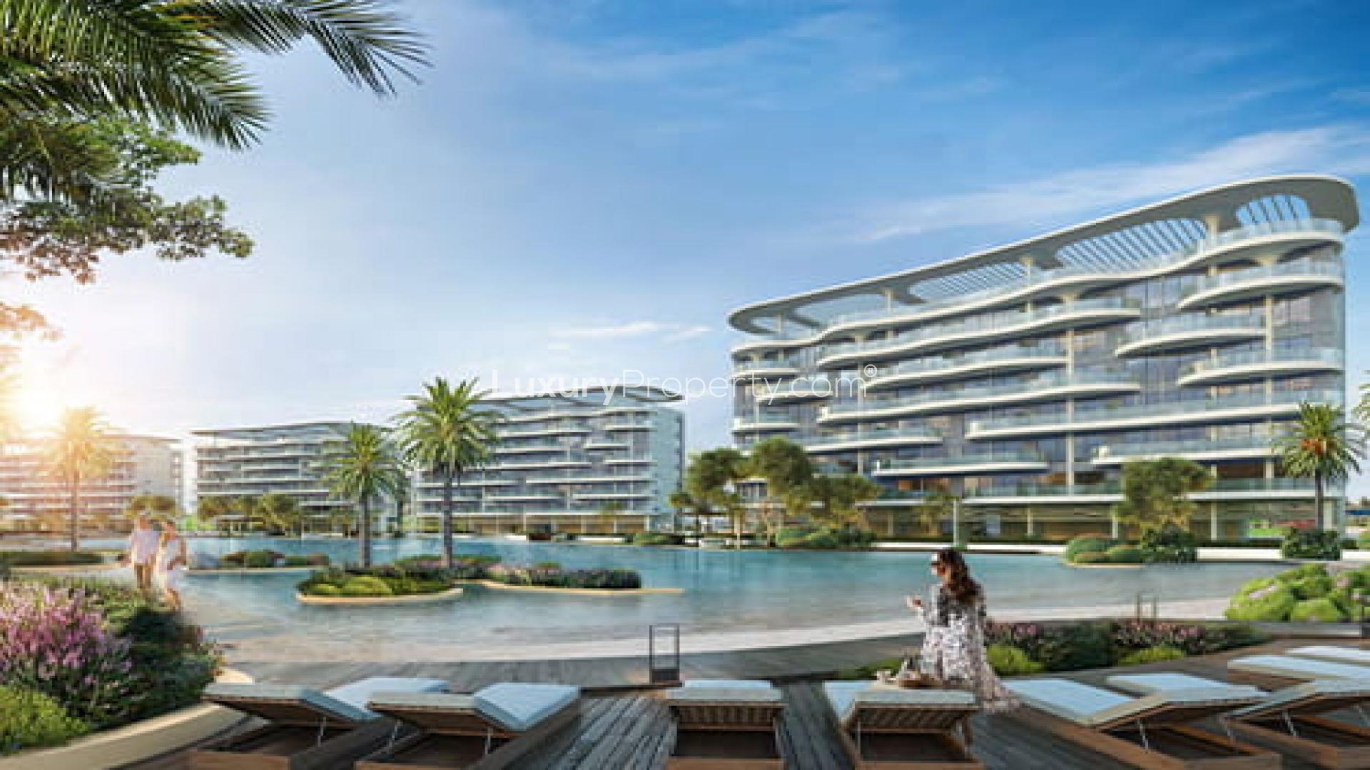"Modern Skyhills Residences towers in Dubai Science Park with lush greenery and clear sky.",Skyhills Residences apartment view with pool and modern architecture in Dubai Science Park