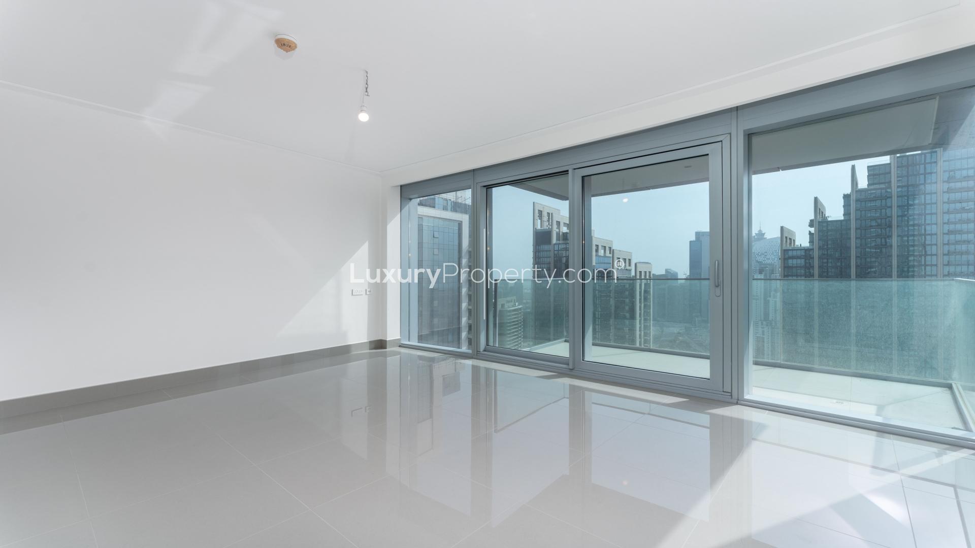 Empty modern apartment interior in Opera District, Downtown Dubai, with large windows and sleek design