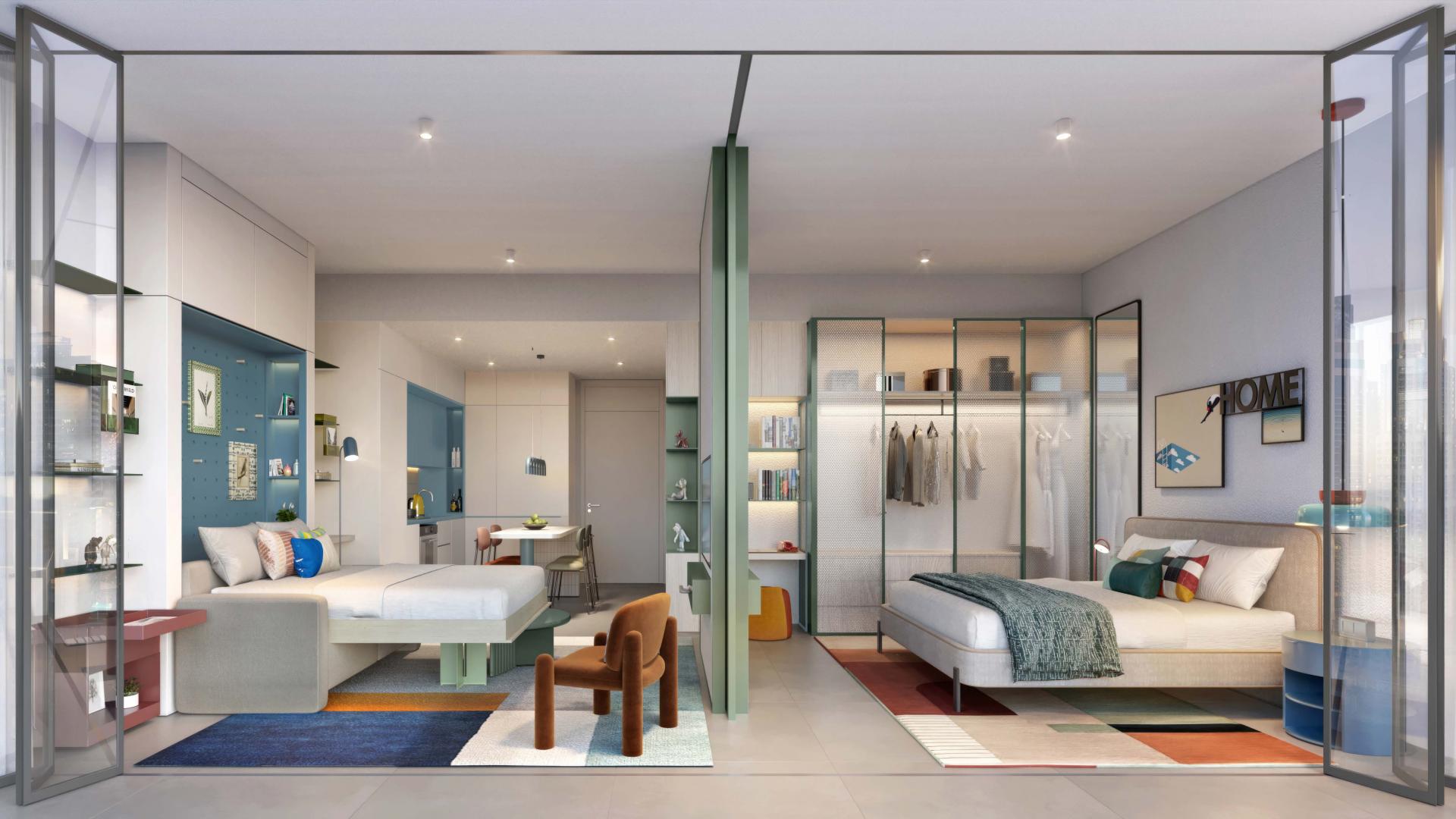 Tall modern apartment building at Rove Home, Business Bay, Dubai, with balconies and sky views