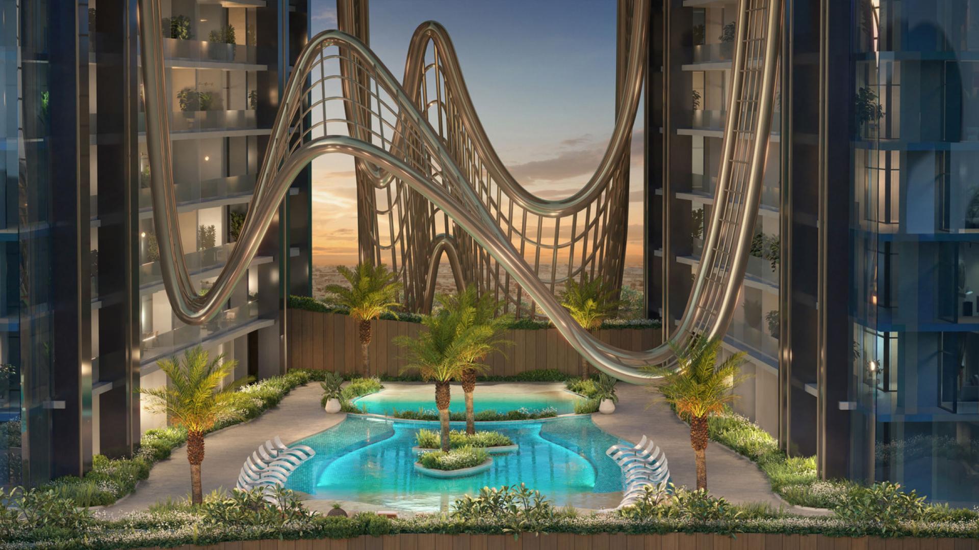 Aerial view of luxurious pool and lounge area at Skyhills Residences, Dubai Science Park